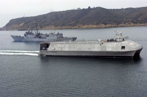 The US Navy Littoral Surface Craft-Experimental SEA FIGHTER (FSF-1), passes the Perry Class Frigate USS RENTZ (FFG 46).
